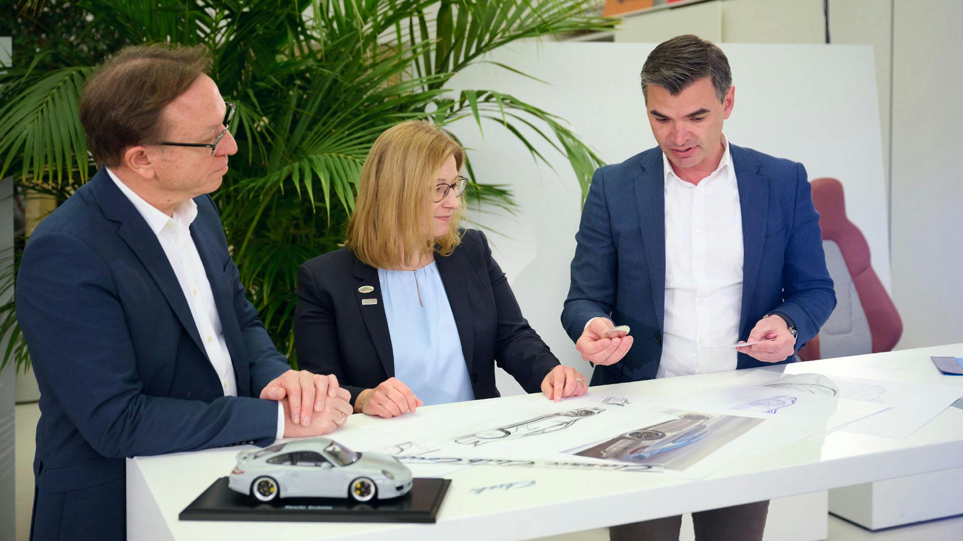 Porsche employees planning in the office