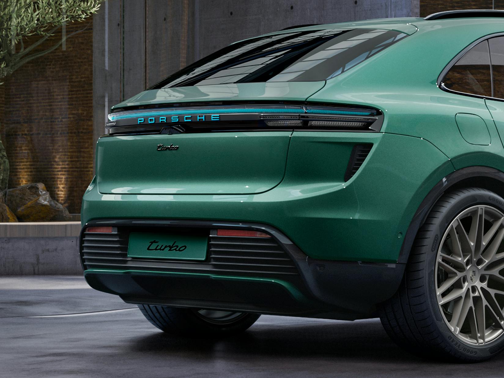 View of the rear of the Porsche Exclusive Manufaktur Macan Turbo in Emerald Green Metallic.
