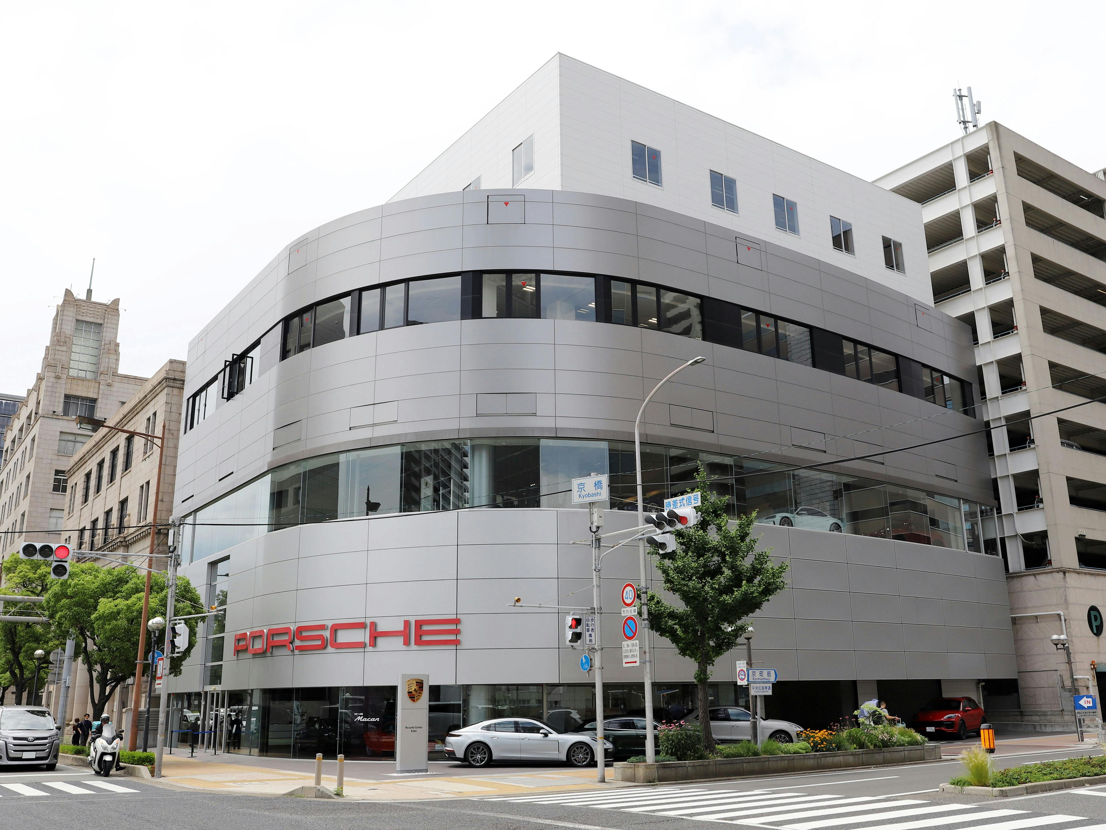 This picture shows the exterior of Porsche Center Kobe, an official Porsche Dealership located in Japan.