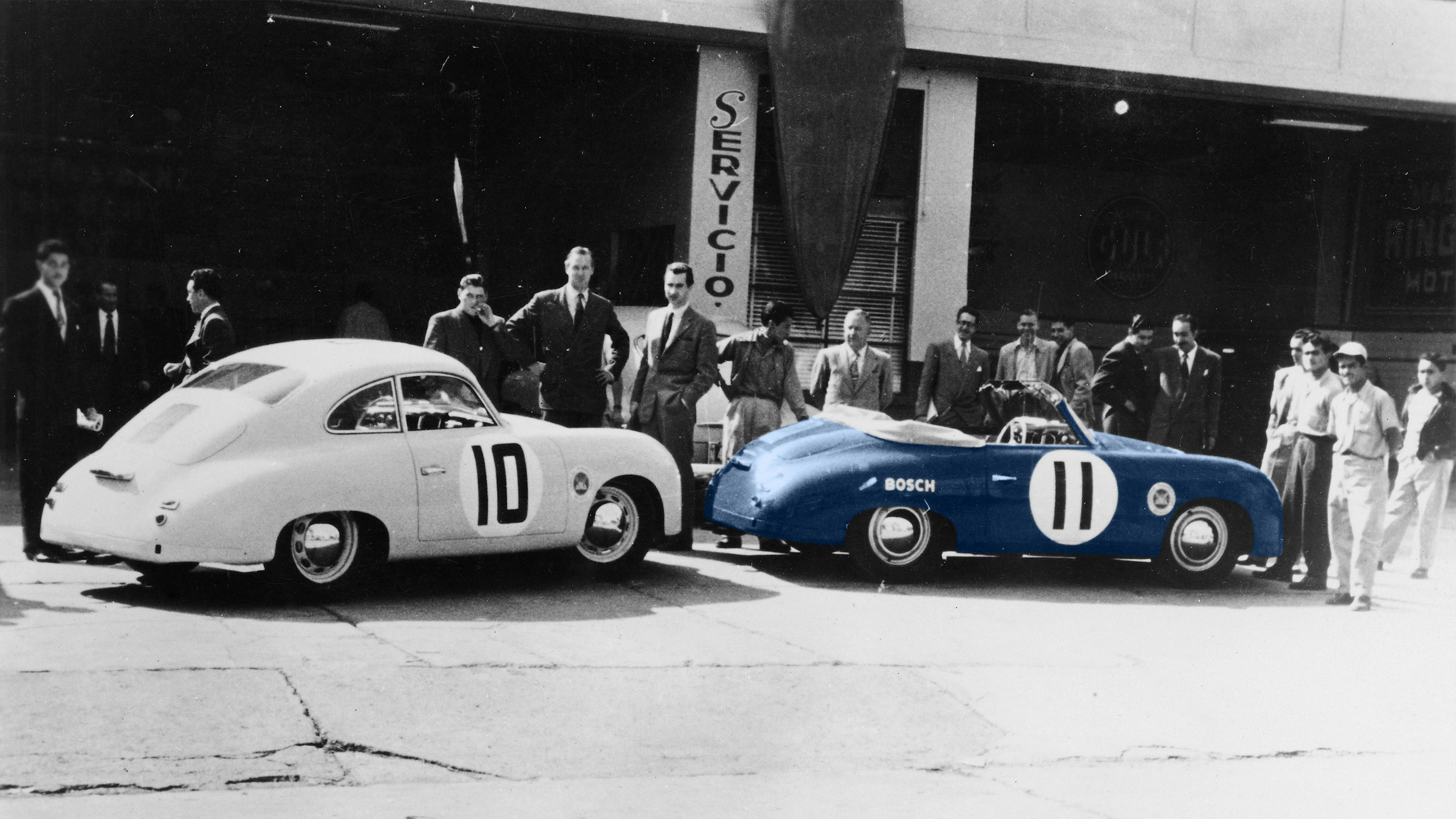 A Porsche 356 S Coupé 1500 cc and a Porsche 356 S Cabriolet, in front of a group of men, circa 1952.
