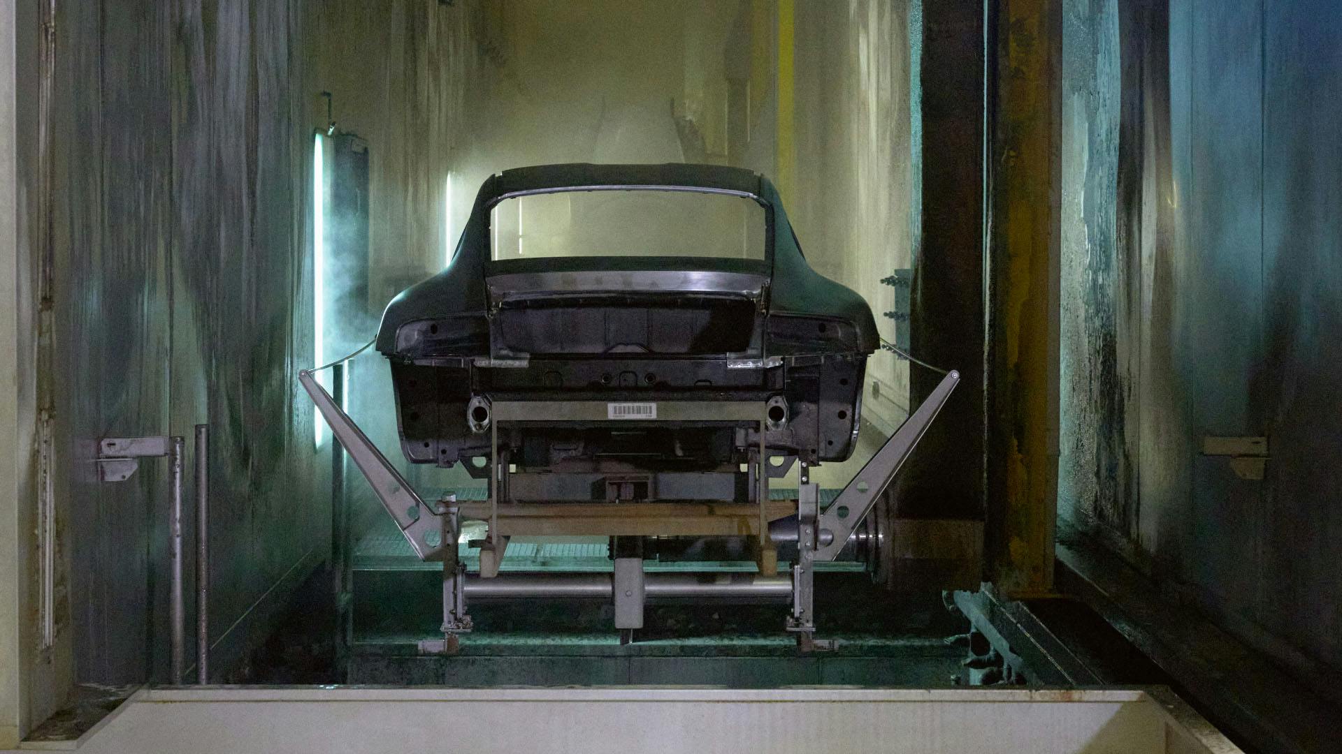 Workshop scene: Porsche bodyshell from behind