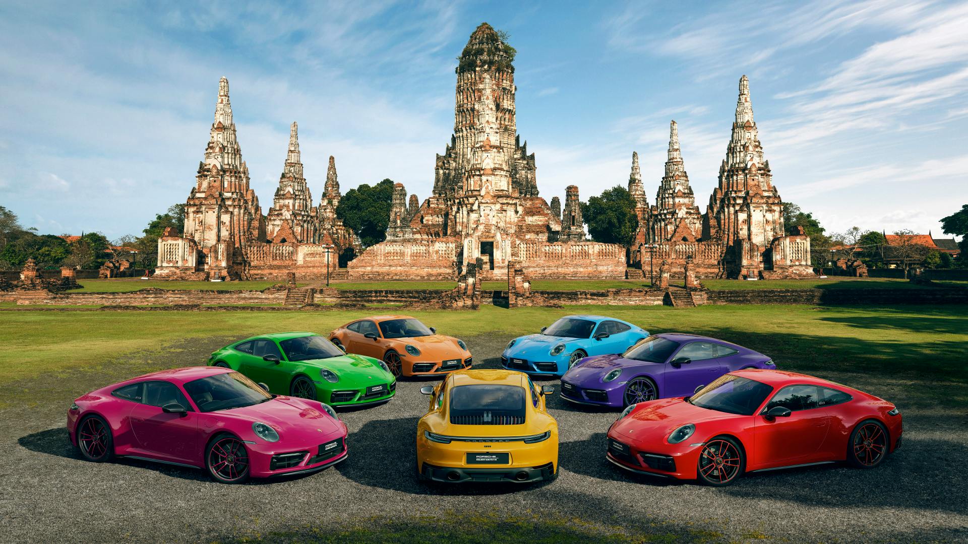 Dreams in Colours: Seven 911 models all in strong different colors in front of the Ayutthaya structures.