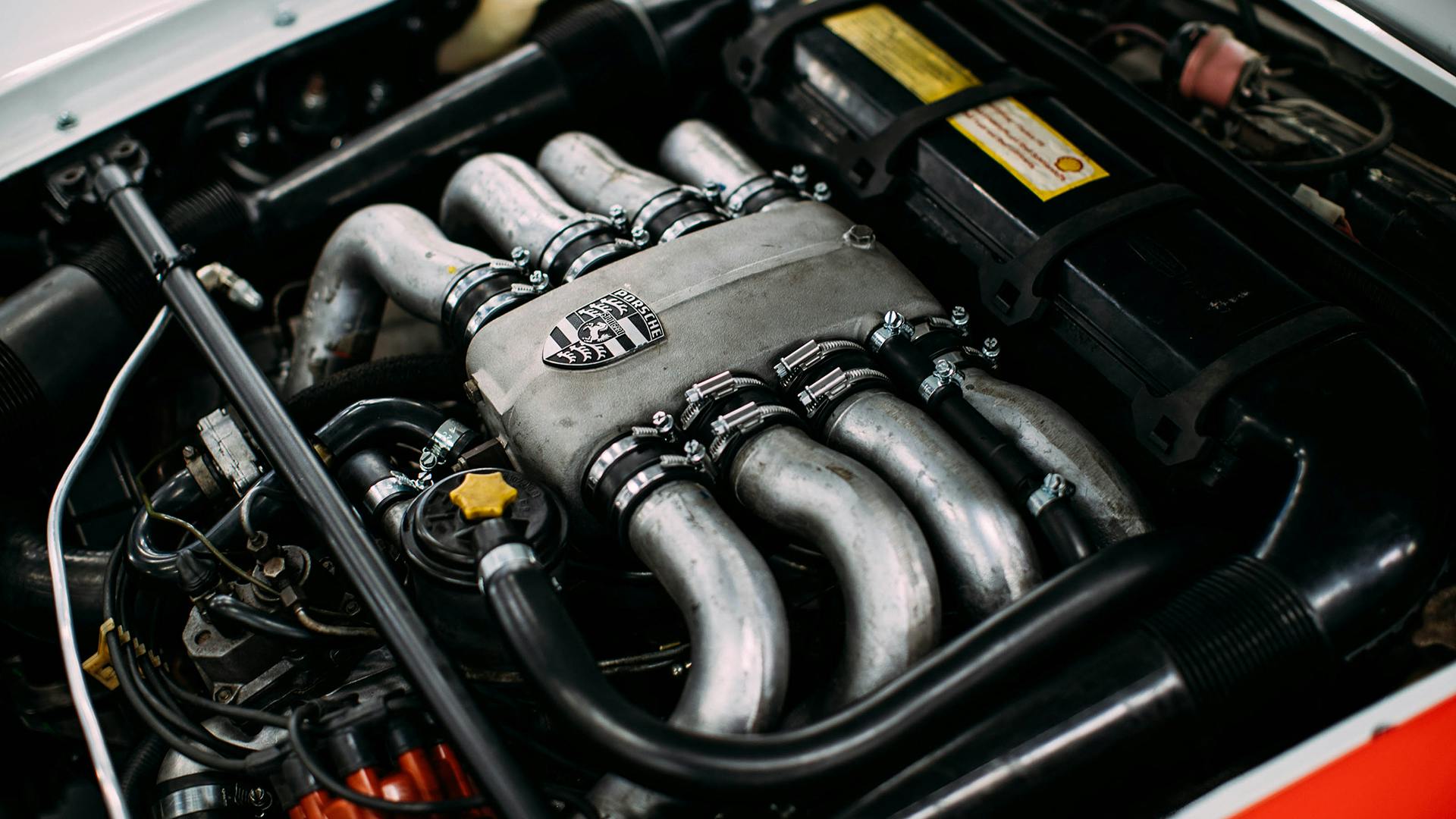 The engine of the Porsche 928 embossed with the Porsche Crest.