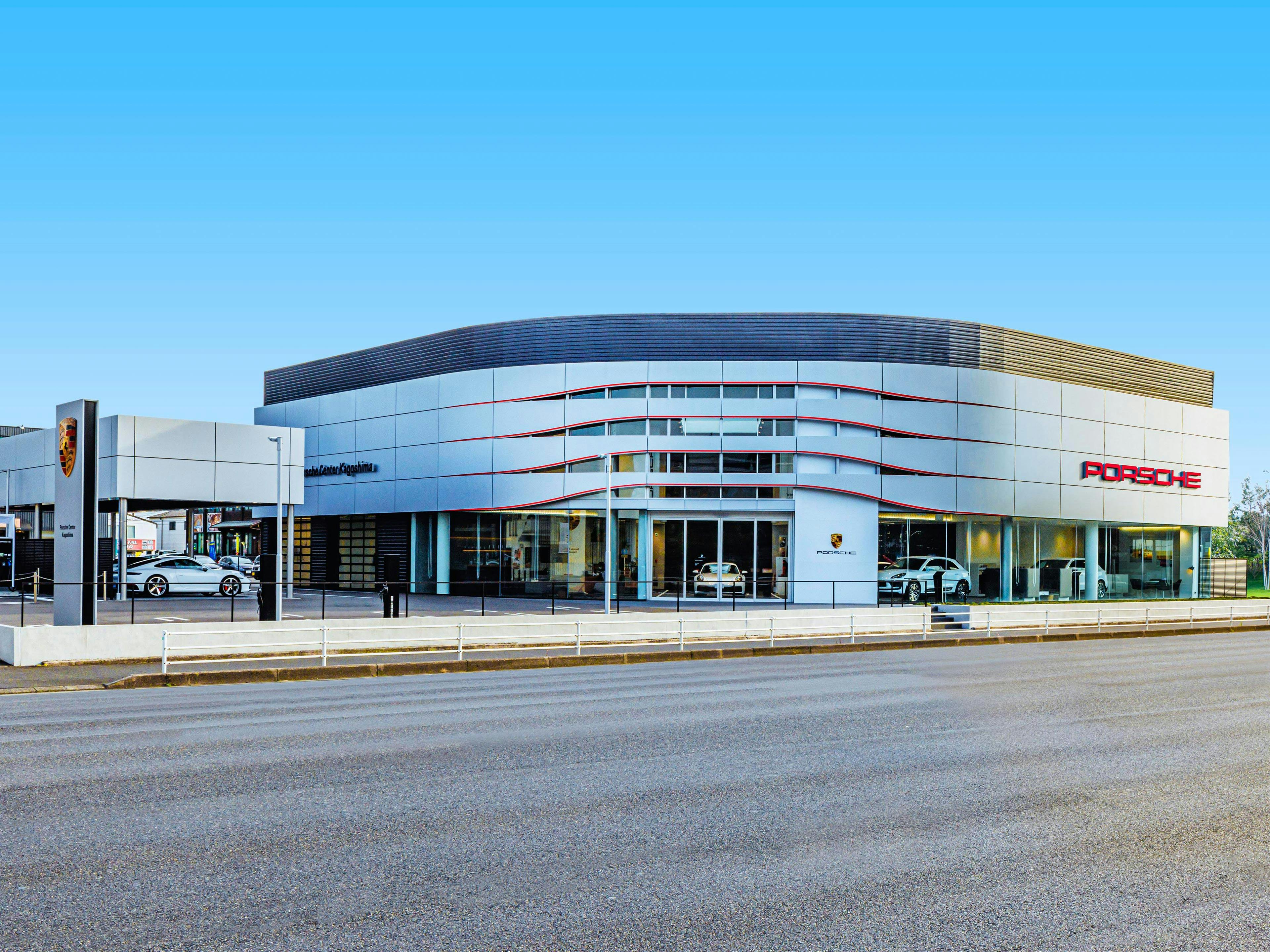 The exterior of the Porsche Center Kagoshima, a Porsche Drive rental station located in Kyushu, Japan.