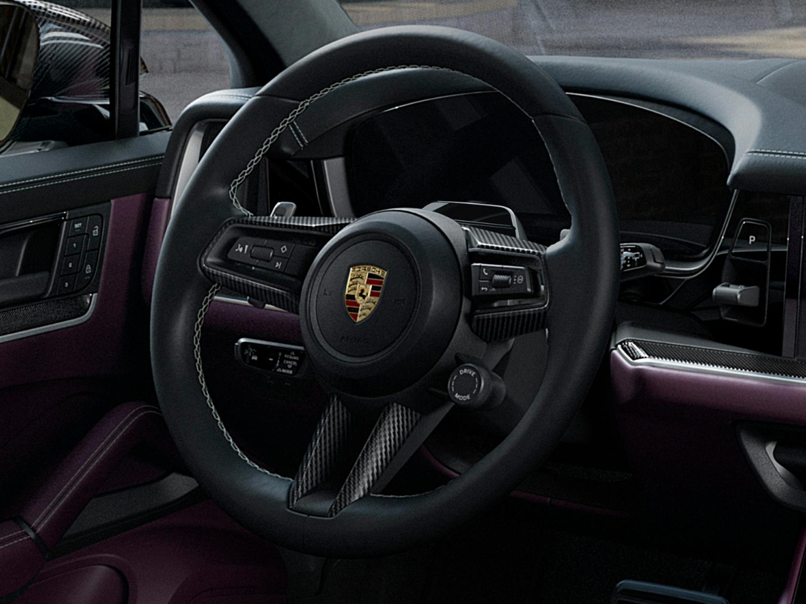 Detailed view of the multifunction GT sport steering wheel with carbon steering wheel trim in the Porsche Exclusive Manufaktur Cayenne S.