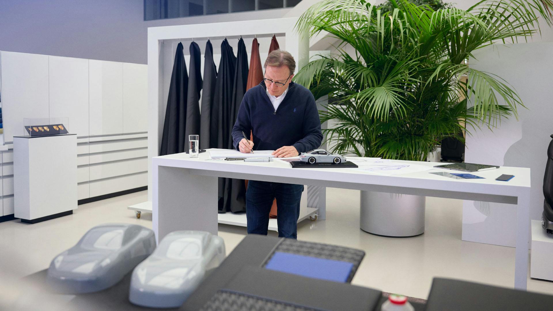 Porsche employees taking notes